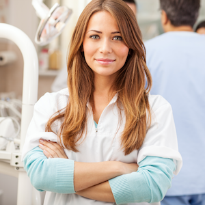 Female Dentist Smiling Arms Crossed with Red Hair Female Dentist Smiling Arms Crossed with Red Hair