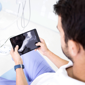 Podiatrist Looking at Foot X-Ray