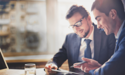 Two Accountants Working with a Laptop Two Accountants Working with a Laptop