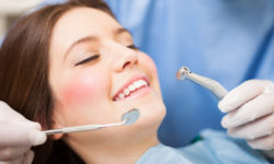 Woman Getting Her Teeth Cleaned at Dentist Woman Getting Her Teeth Cleaned at Dentist